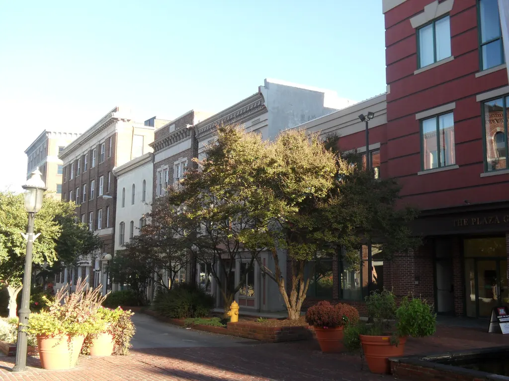Historic brick storefronts, trees, and planters along Salisbury Main Street