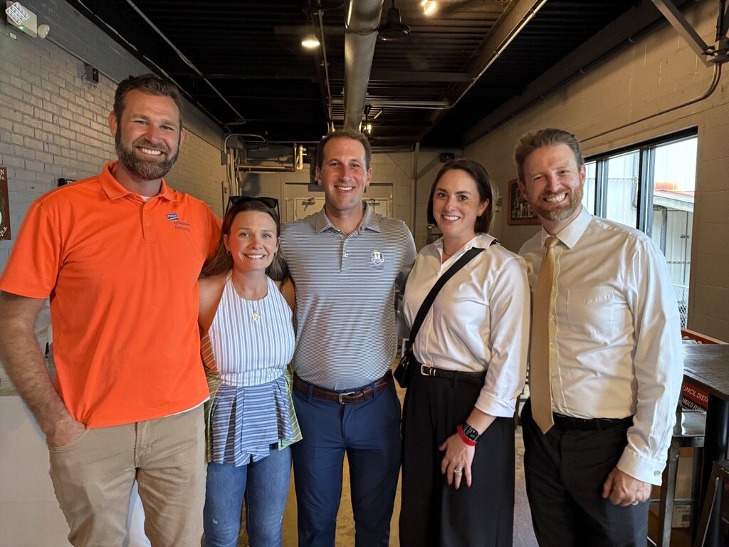 Ross Evans with four attendees at the Evolution Brewing fundraiser.