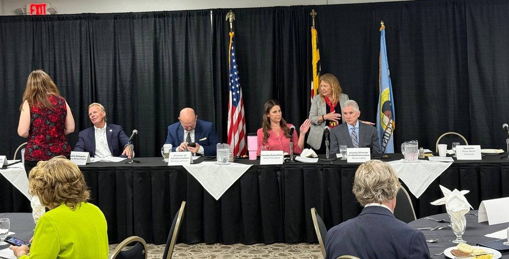 Attendees seated at round tables listening to the panel at the Wicomico legislative breakfast.